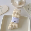 Creamy white cable knit socks with ribbed texture and minimalist paper packaging wrap - One Size / Creamy Yellow