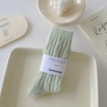 Light green chunky rib-knit wool socks featuring a minimalist premium paper wrap - One Size / Cream Green