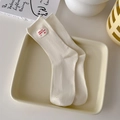 Ribbed crew socks in cream white featuring a red printed label decor for women - One Size / Cream