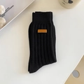 Classic black ribbed knit crew socks with vintage brown leather patch detail - One Size / Black