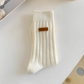 Mid-calf cream knit socks with vertical ribbing and a stylish brown leather patch detail - One Size / Creamy White