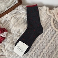 Dark grey crew socks featuring red polka dots and a vibrant red trim on the cuffs - Polka Dot Gray Style