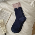 Navy blue crew socks with striped cuff and button detail on white bed sheet - One Size / Navy Red