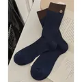 Navy blue ribbed crew socks with brown contrast trim and vintage button accent - Navy Blue