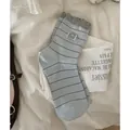 Light blue striped crew socks with panda patch and grey ruffled cuffs for women - One Size / Light Blue