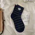Striped navy blue panda socks with cream ruffle cuffs and cotton knit texture - One Size / Navy Blue