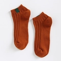 Burnt orange knit ankle socks with vertical ribbed texture and green fabric label detail - One Size / Orange