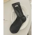 Dark grey knitted cotton socks with white letter label and subtle polka dot texture - Dark Gray