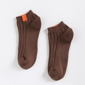 Women's dark brown ribbed cotton socks featuring a contrast orange decorative label - One Size / Coffee