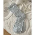 Light blue crew socks with vertical pleated texture and white button decorative detail - Light Blue