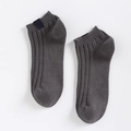 Deep grey low-cut cotton socks featuring ribbed texture and stylish fabric label - One Size / Dark Gray