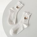 Calze medie beige con bordo in pizzo bianco e ricamo a fiori gialli e verdi - Taglia unica / Bianco
