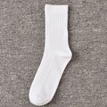 Classic white crew socks with vertical ribbed texture and elastic cuffs for daily sports - White