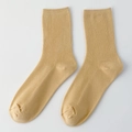 Ribbed mid-calf socks in ginger yellow featuring classic knit texture and elastic cuffs - One Size / Beige