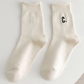 Creamy white cotton socks with black embroidered letter C and ribbed knit texture - One Size / Rice Black