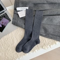 Thick dark grey wool over-knee socks featuring a premium ribbed knit texture for winter - Gray