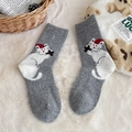 Gray wool socks featuring a cute cartoon cat with a festive Christmas hat and star - One Size / Light Gray
