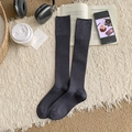 Dark grey ribbed cashmere calf socks for women in a cozy winter home setting - One Size / Gray