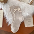 Calze in lana beige a pois con fiocco decorativo per calore invernale e uno stile dolce - Color Farina d'Avena