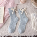 Light blue knit wool socks featuring cream plush bows and vertical ribbed texture - One Size / Sky Blue