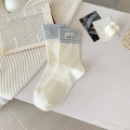 Calze color crema a righe azzurre con etichetta fatta a mano di cuccioli - Taglia unica / crema