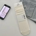 Creamy white rib knit wool socks with brand tags and labels on a minimalist background - Milky White (1 Pair)