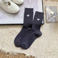 Dark grey ribbed crew socks with white heart embroidery on a cozy lifestyle background - Dark Gray