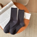 Dark grey ribbed knit crew socks displayed on a modern tray for a cozy lifestyle feel - Dark Grey Solid