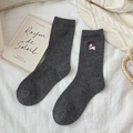 Dark grey wool mid-calf socks with cute white dog embroidery in a cozy lifestyle setting - Dark Gray