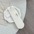 Chaussettes en laine blanc crème avec texture en maille côtelée et style décontracté - Taille unique / Blanc Cassé