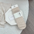 Light coffee ribbed wool mid-calf socks for women on a ceramic plate with warm minimalist background - One Size / Oatmeal (1 Pair)