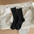 Thick knit crew socks in black with colorful specks and ribbed texture for winter warmth - Black
