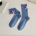 Blue knitted mid-tube socks with pink ruffled edges and a decorative silk bow - Blue