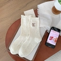 Calze di lana color crema con puntini arcobaleno e delicati ricami decorativi - Lettera Bianca