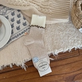 Oatmeal knit mid-calf socks featuring white ruffled edges and a classic ribbed texture - Oatmeal