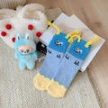 Funny blue clown coral fleece socks with colorful stripes and fuzzy toy accessory - One Size / Light Blue