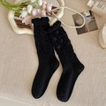 Sweet black calf socks with 3D roses, ruffled cuffs, and elegant pleated texture - One Size / Black