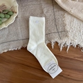 Calze in cotone crema con coste verticali e delicati ricami a fiocco in piano - Bianco Crema