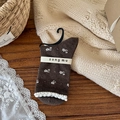 Calze marroni vintage in cotone con piccoli fiori bianchi e bordi a volant - Floreale Intenso