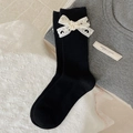 Lolita style black mid-calf socks with white lace bows and heart cut-out patterns - One Size / Black