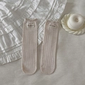 Chaussettes en tricot crème avec bordure ondulée et étiquette 'Own the moment' - Taille unique / Couleur Avoine