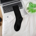 Classic cotton mid-calf slouch socks in solid black with ribbed cuffs and soft texture - One Size / Black
