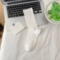 White knit mid-calf slouch socks with soft cotton texture on a minimal desktop background - One Size / Cream