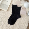 Black mid-calf cotton socks with 3D embossed knit patterns and chic ruffled cuffs - One Size / Black
