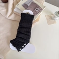 Scaldamuscoli neri in maglia con bottoni bianchi, texture a coste e design morbido - Nero