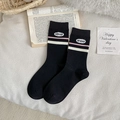 Black cotton crew socks with pink-white stripes and sheep embroidery on a cozy background - Black Alphabet Stripes