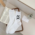 White ribbed mid-calf socks featuring dual black velvet bows in a stylish wooden tray - One Size / White