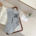 Heather gray mid-calf socks with white lace and black double bows in a flat lay view - One Size / Light Gray