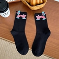 Cute black crew socks featuring pink polka dot cat patterns with blue bow tie accents - Black