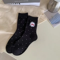 Designer black crew socks with white polka dots, plush balls and red bow decoration - Black Polka Dot White Fur Ball